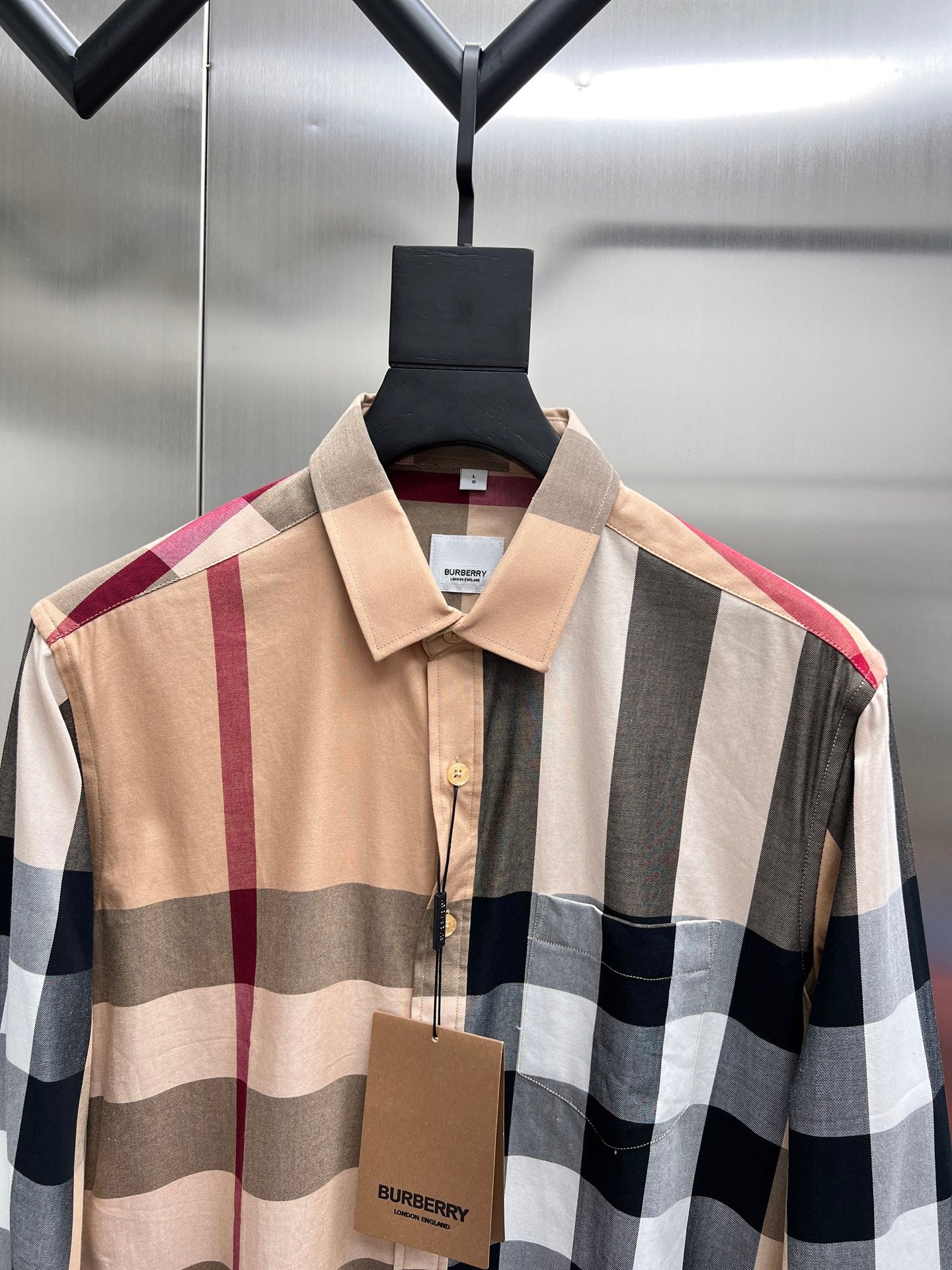 Burberry plaid long-sleeve shirt with beige collar and button placket