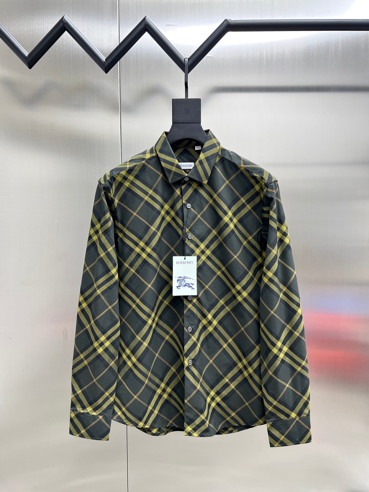 Plaid long-sleeve button-up shirt with pointed collar and front button placket
