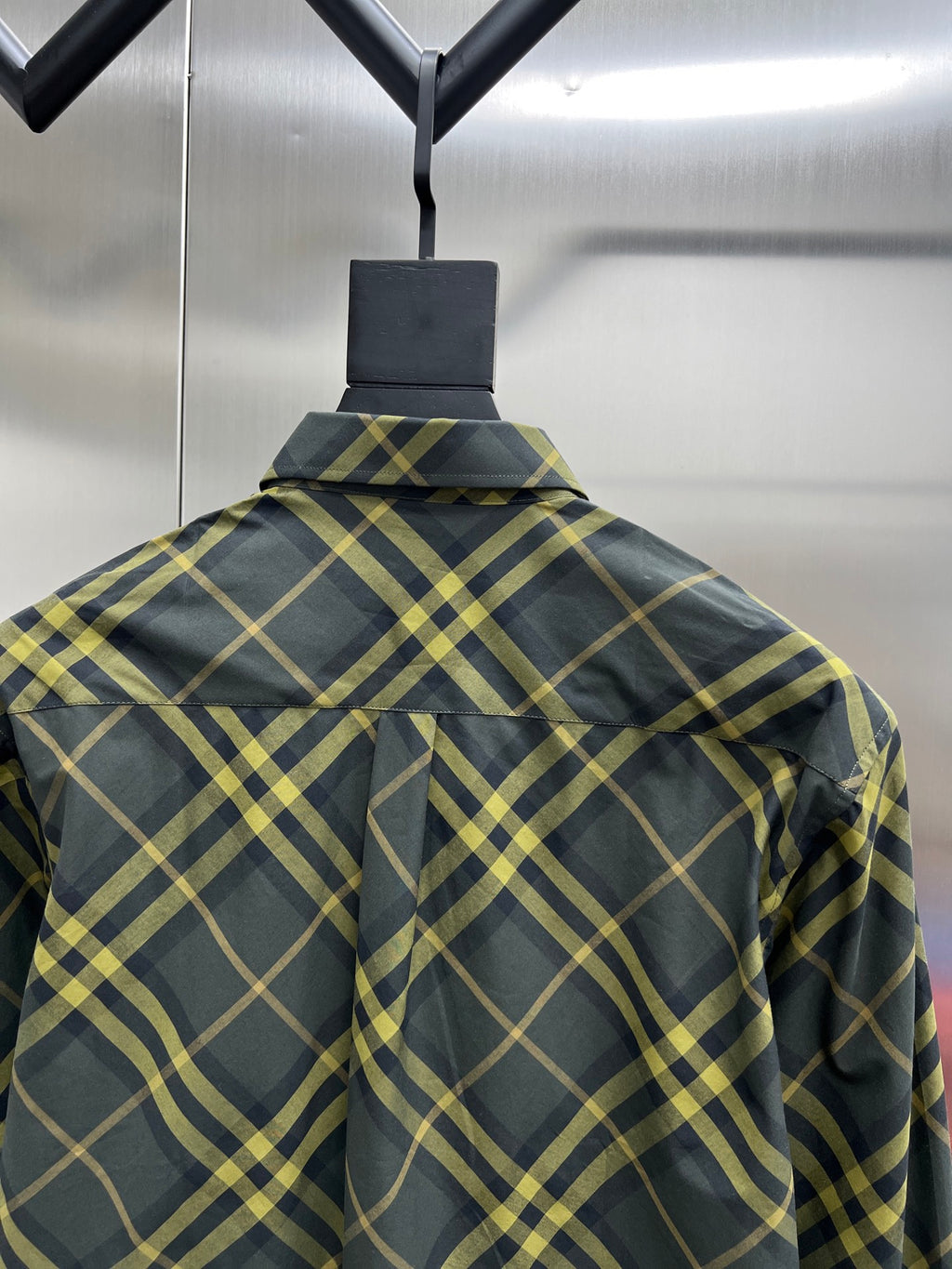 Back of long-sleeve plaid shirt with yoke and button placket
