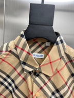 Burberry plaid shirt neckline with button placket and beige collar