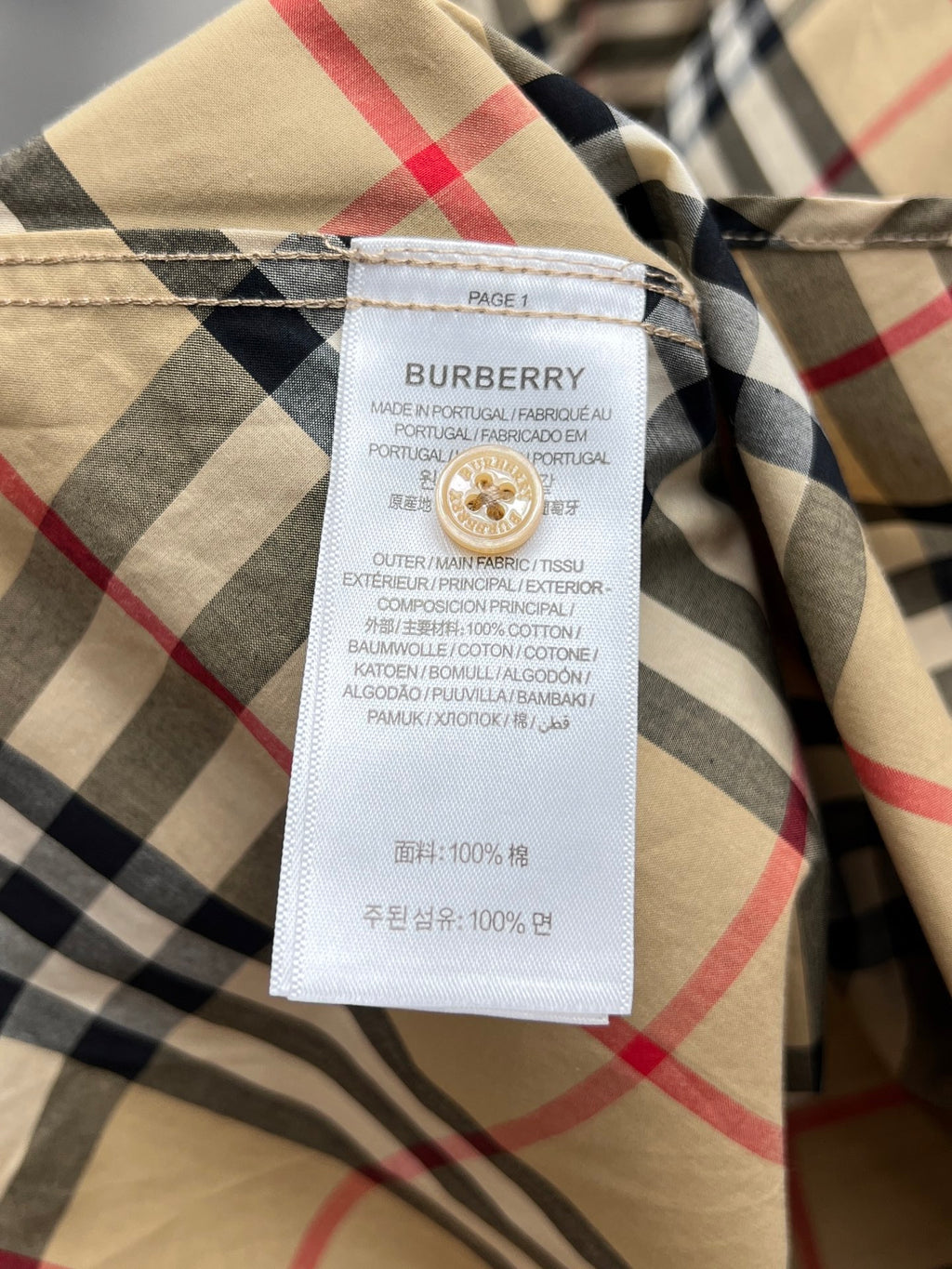 Burberry plaid button-up shirt interior neck label with size and care details