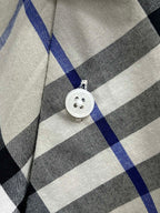 Burberry shirt button detail on blue black and white check plaid