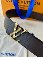 Louis Vuitton belt close-up: textured dark strap with gold-tone buckle detail