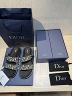 Unisex Dior slide sandals with monogram print straps and Dior-branded footbeds