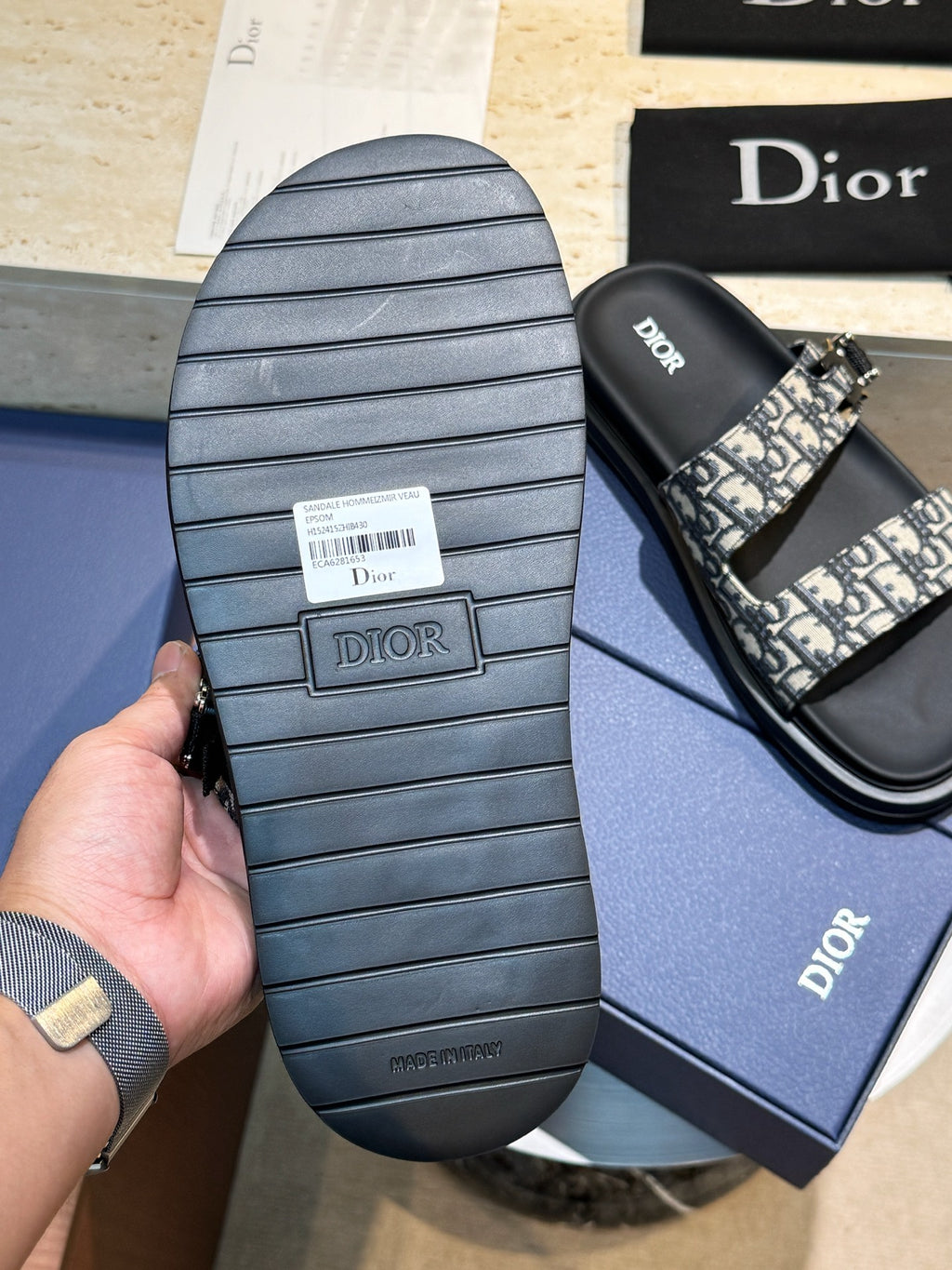 Unisex Dior slide sandal sole with ridged rubber tread and monogram strap