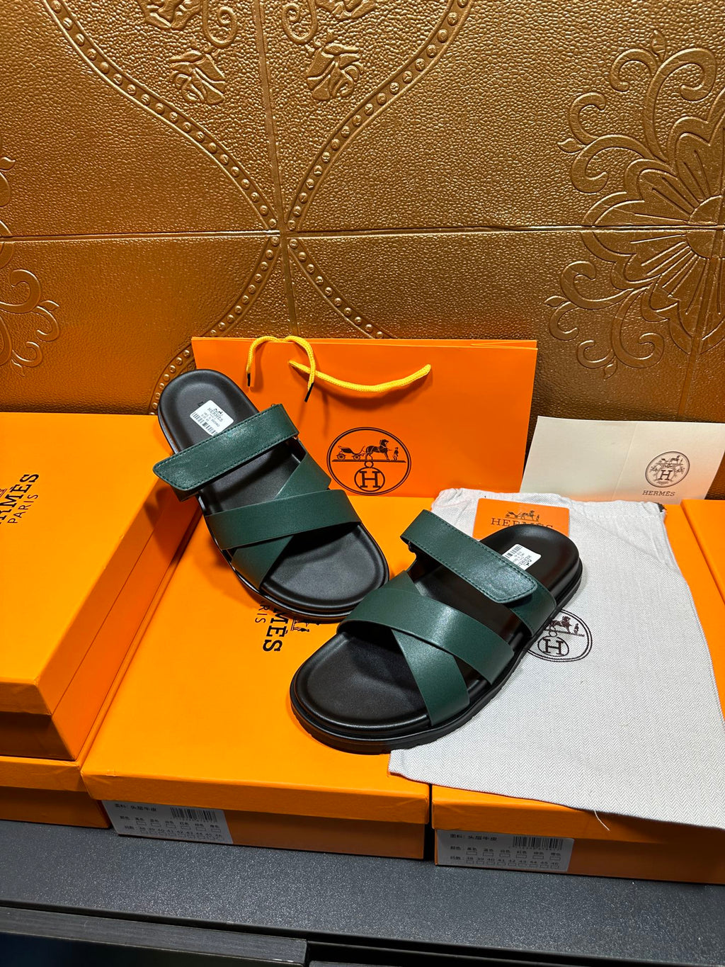 Hermes green double-strap sandals with adjustable look and black rubber soles