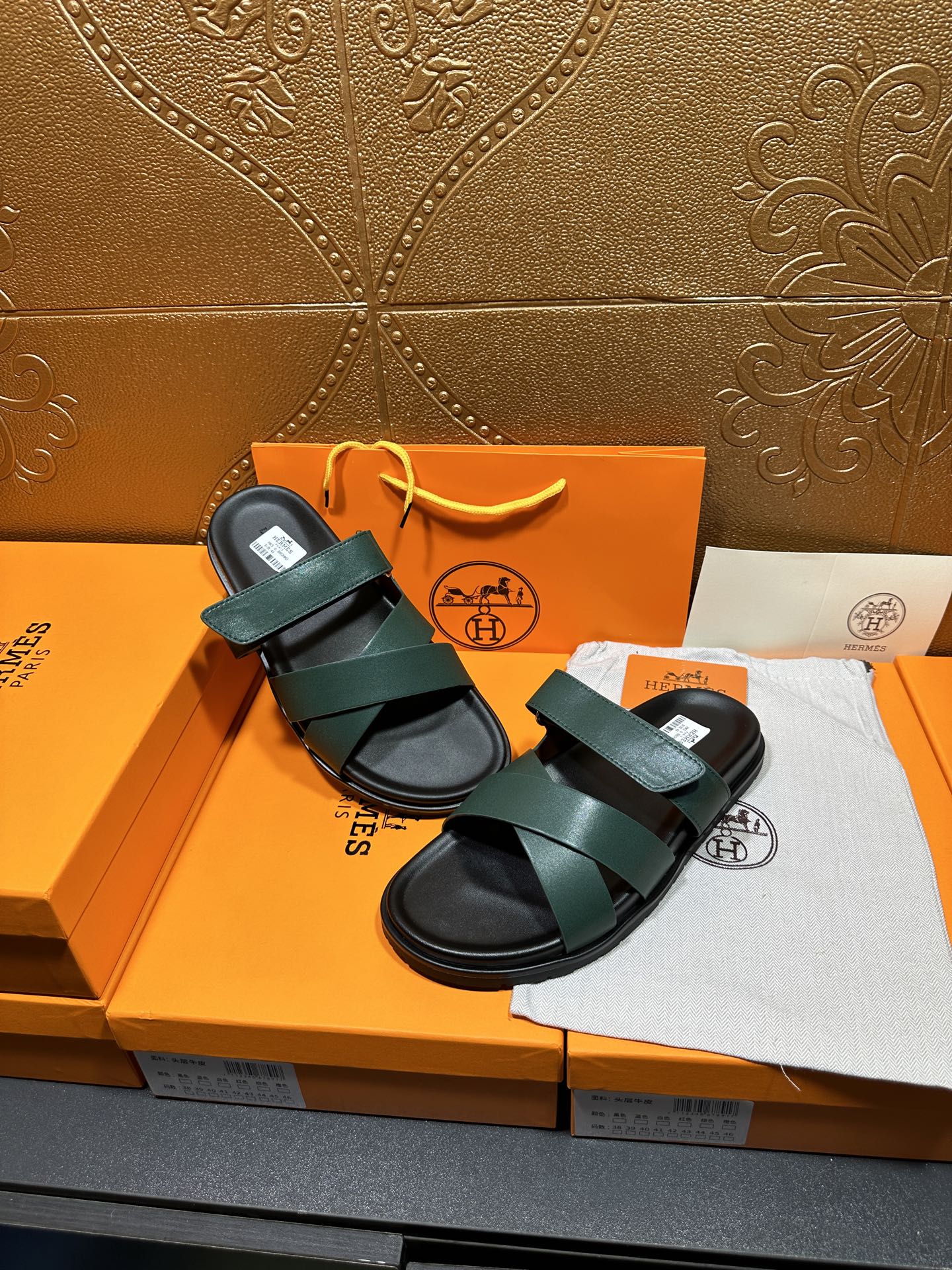 Hermes green double-strap sandals with adjustable look and black rubber soles