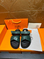 Hermes sandals with teal green wide straps and black cushioned footbeds
