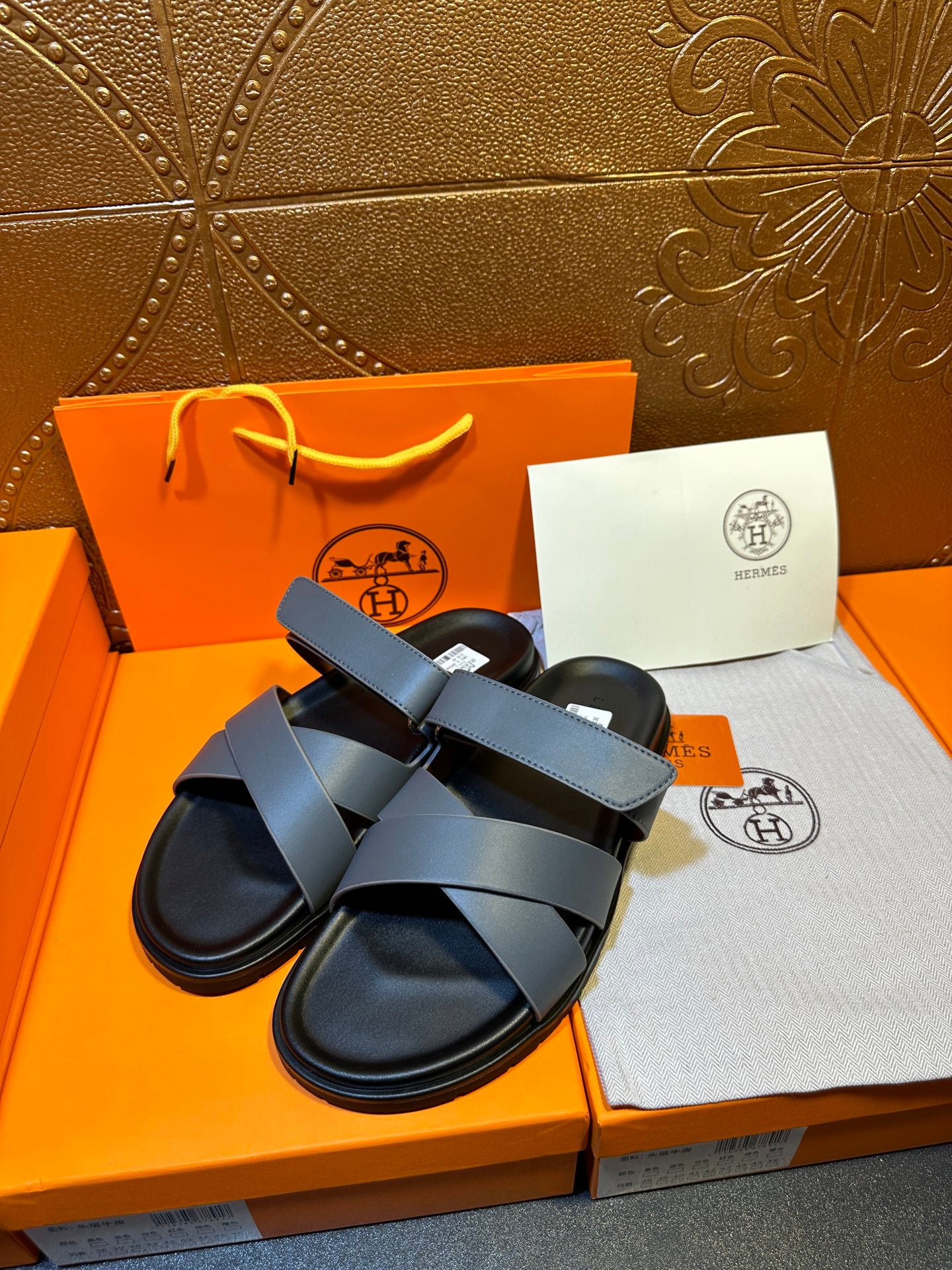 Hermes slide sandals with double navy straps and black molded footbeds