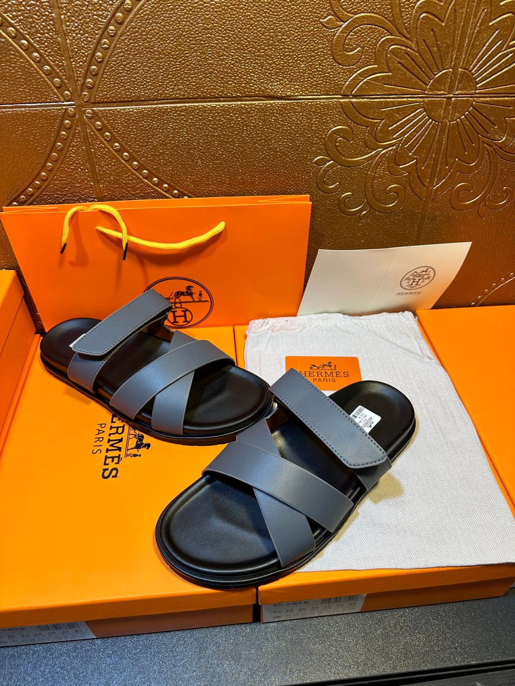 Hermes slide sandals with wide navy band straps and black soles