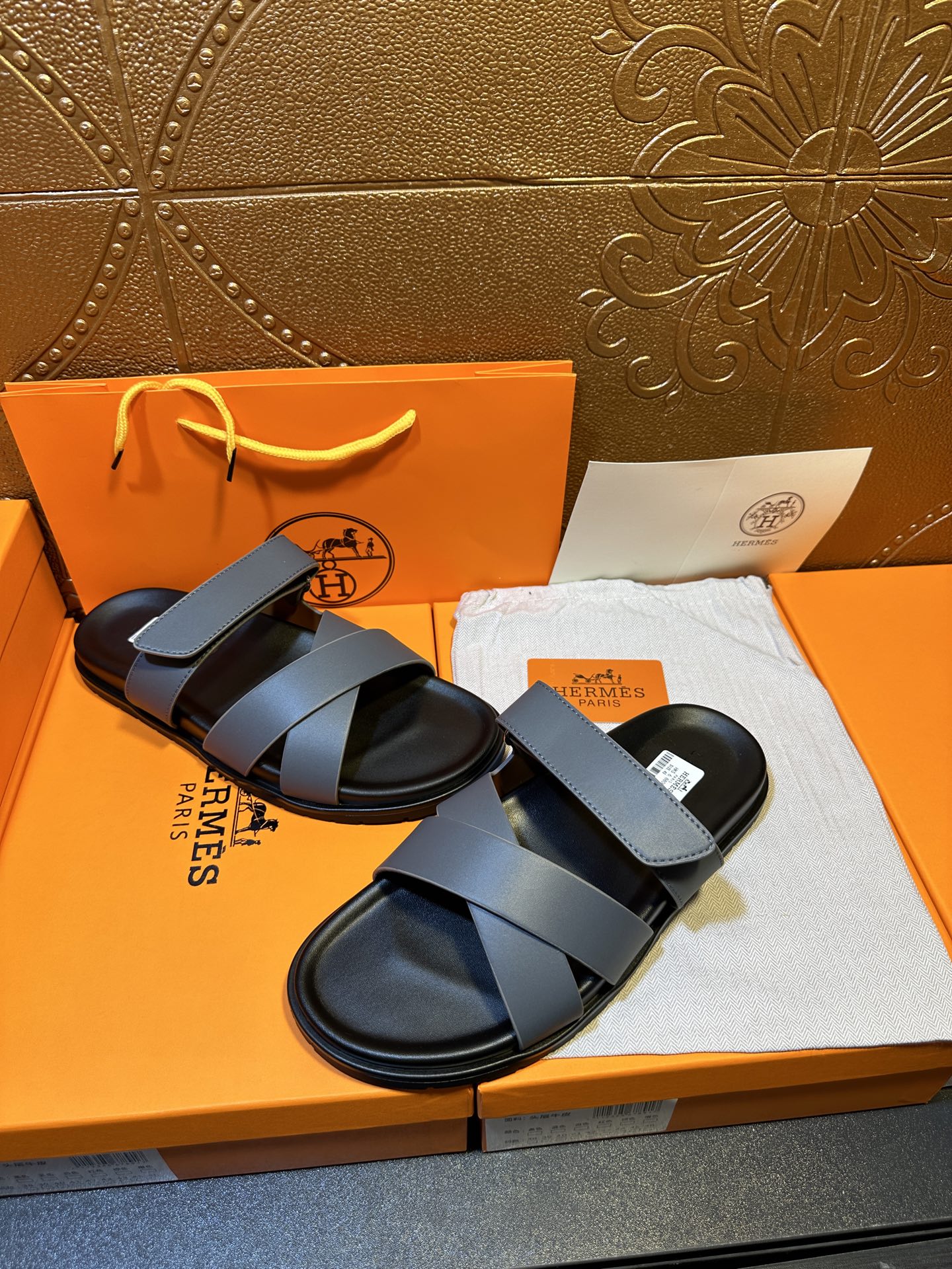 Hermes slide sandals with wide navy band straps and black soles
