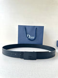 Leather belt in dark blue with rectangular buckle featuring a CD emblem