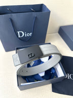 White leather belt with dark rectangular buckle and embossed Dior-style strap