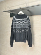 Long-sleeve knit sweater in dark gray with white fair isle pattern, rear view