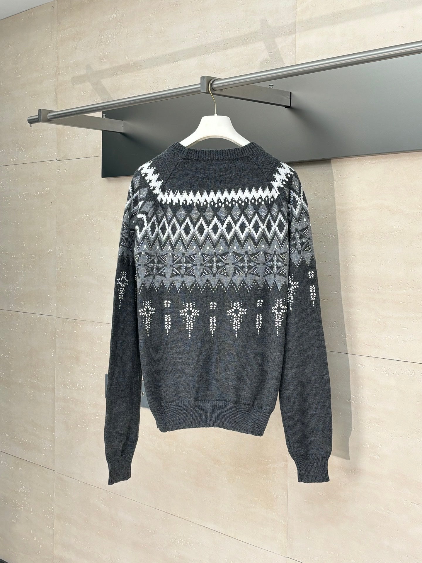 Long-sleeve knit sweater in dark gray with white fair isle pattern, rear view