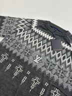 Dark gray sweater knit with geometric fair isle pattern; Louis Vuitton tag on chest
