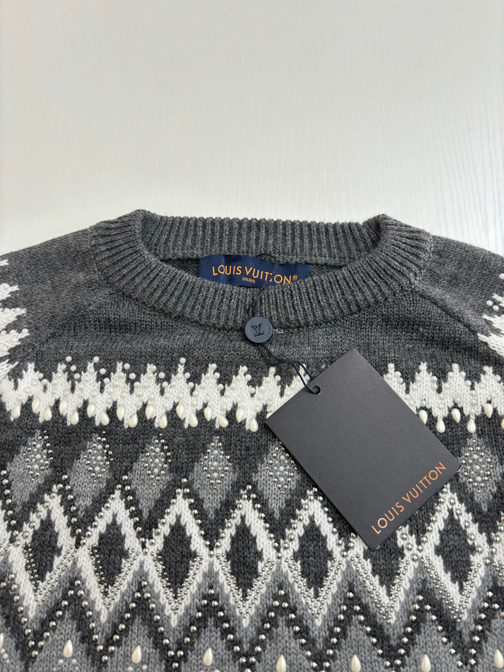 Dark gray knit sweater collar with button; white fair isle pattern, Louis Vuitton tag
