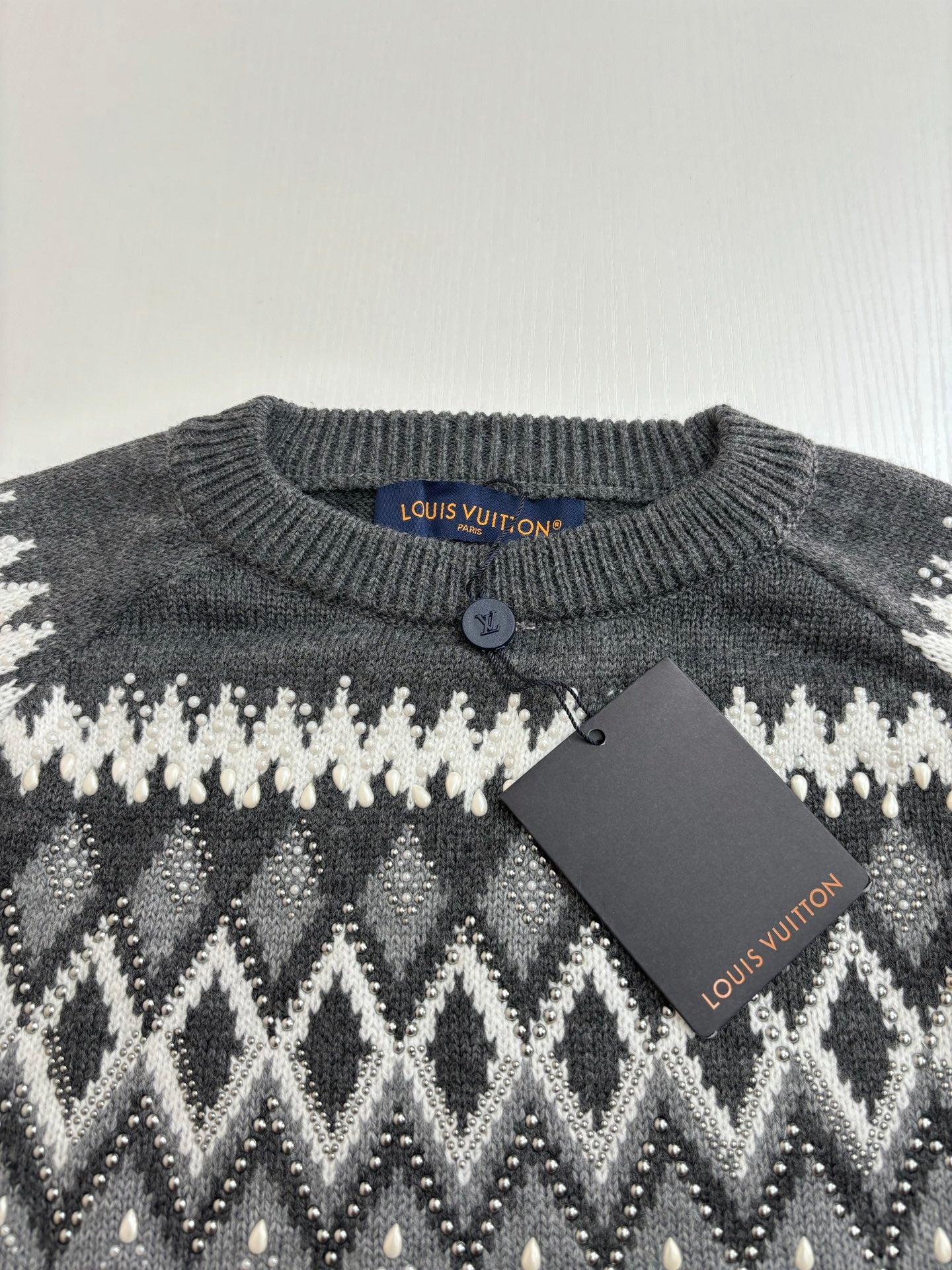 Dark gray knit sweater collar with button; white fair isle pattern, Louis Vuitton tag
