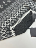 Dark gray knit sweater shoulder with zigzag fair isle pattern; Louis Vuitton tag
