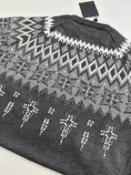 Dark gray knit sweater back with white zigzag fair isle pattern; Louis Vuitton tag