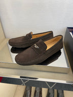 Brown suede loafers with Prada logo on side, slip-on moccasin style