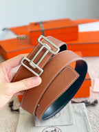 Tan leather belt with silver buckle hardware, 38mm strap