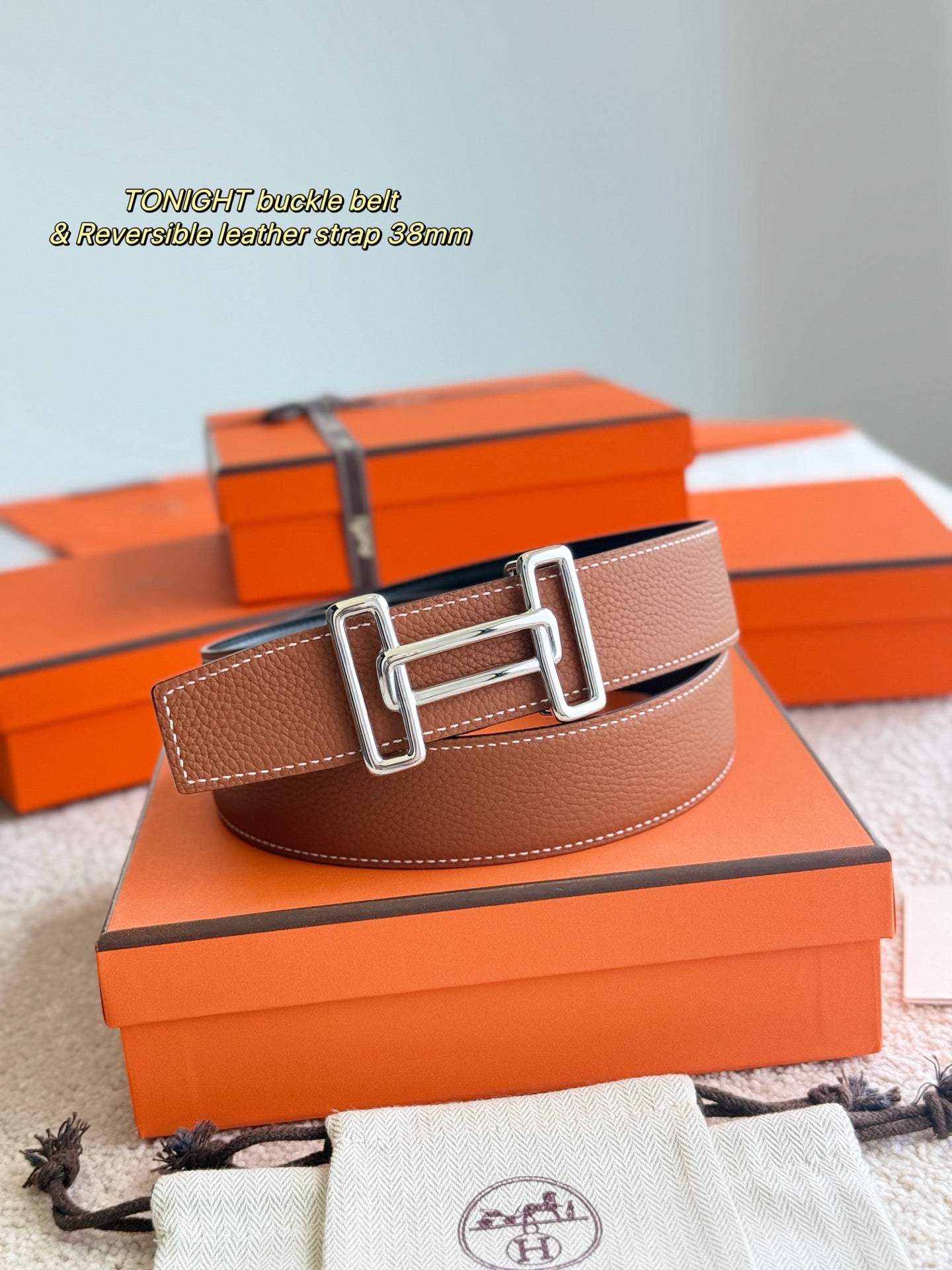 Tan leather reversible belt with silver buckle, 38mm strap