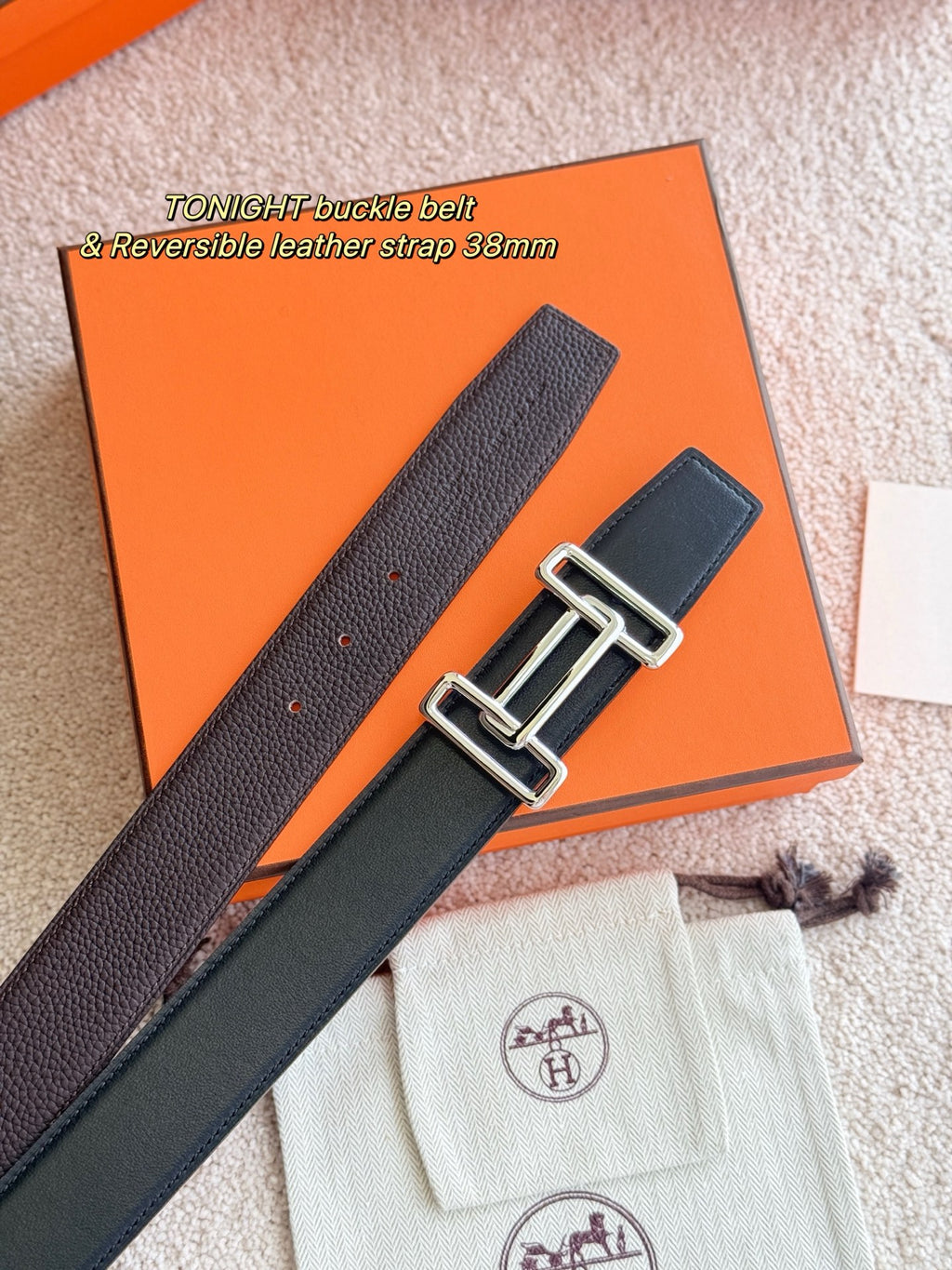 Hermes reversible belt strap with silver buckle hardware, shown flat