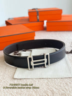 Hermes reversible leather belt in dark leather with silver buckle, side view