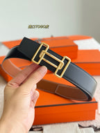 Reversible leather belt with gold-tone buckle, dark leather strap with stitched edges