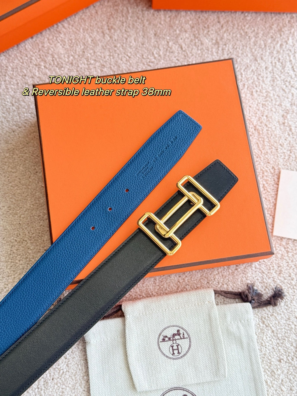 Blue leather belt with gold-tone buckle hardware detail