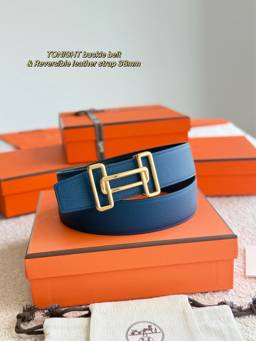 Blue leather belt with gold-tone double buckle
