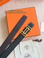 Reversible leather belt showing strap sections and gold double-buckle hardware.