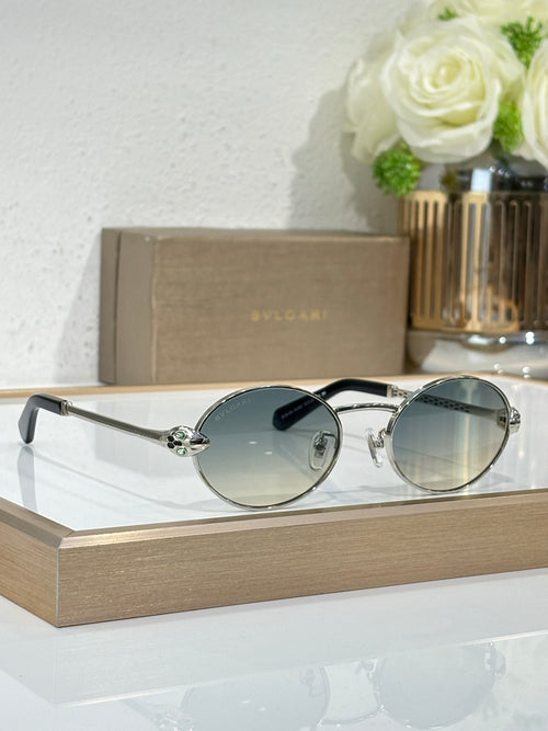 Bvlgari round sunglasses with silver metal frame and blue-tinted lenses