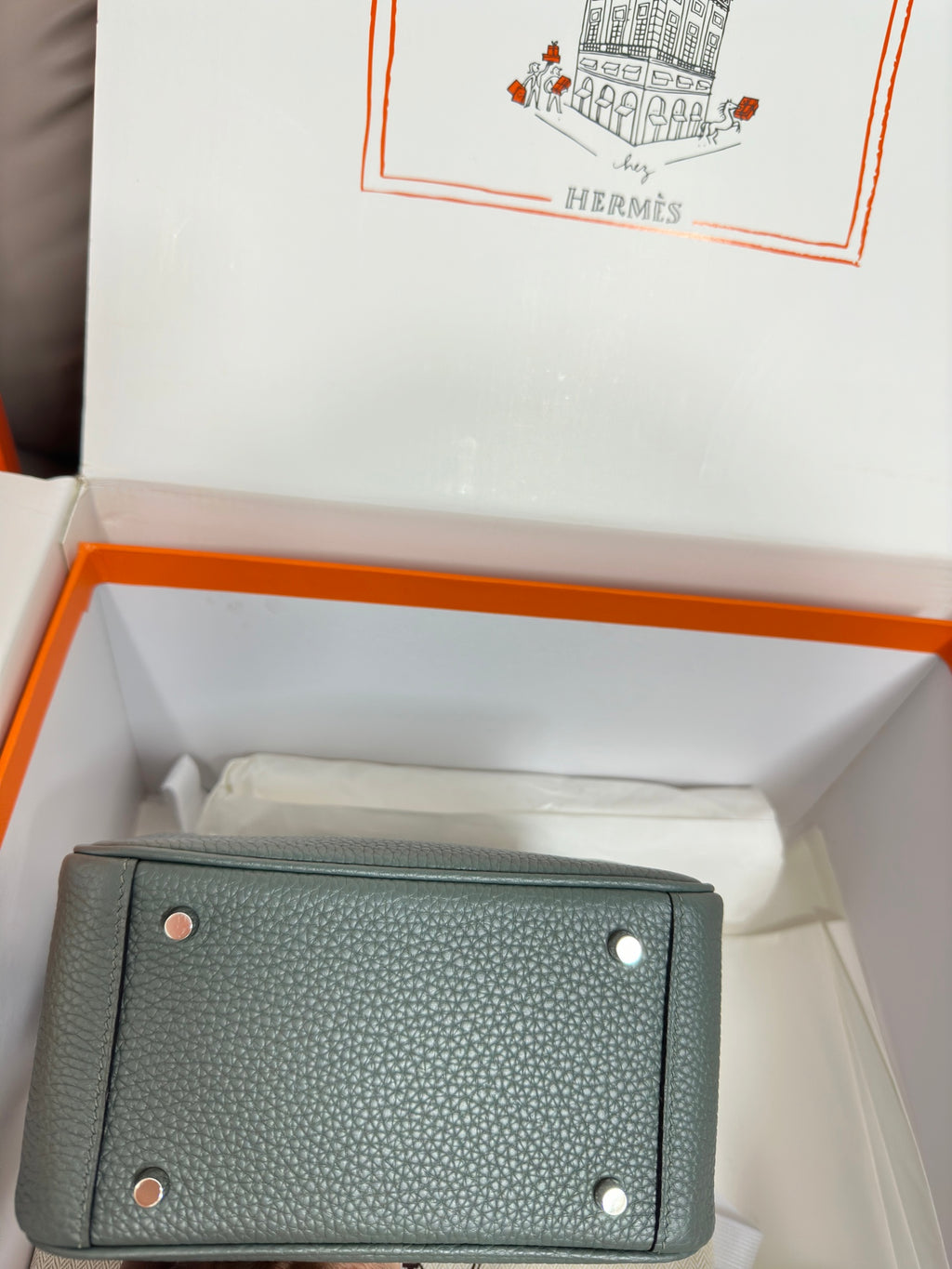 Hermes bag, dark teal pebbled leather, back panel with metal studs, laid in box.