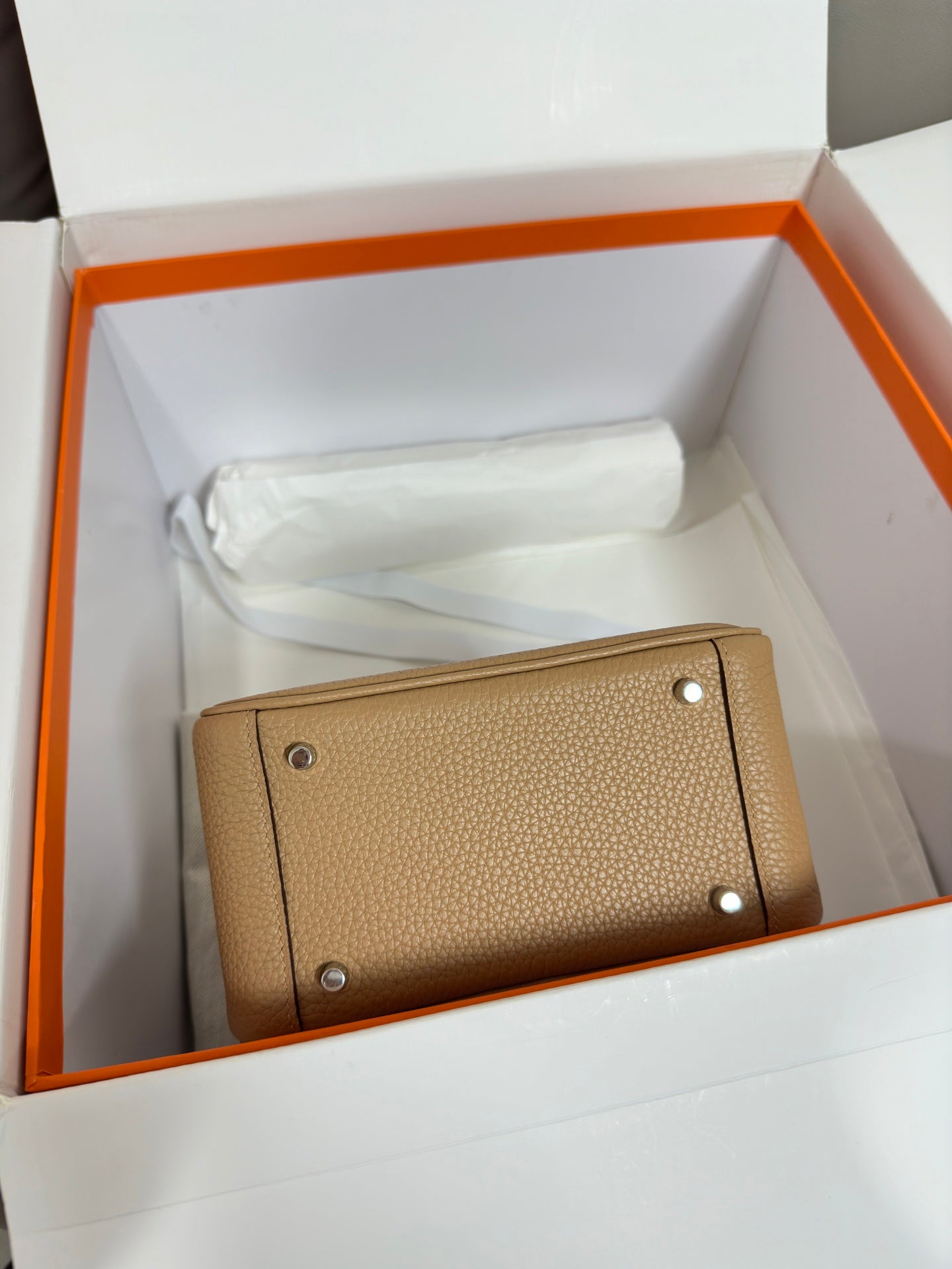 Hermes beige leather card case with snap buttons and smooth textured finish