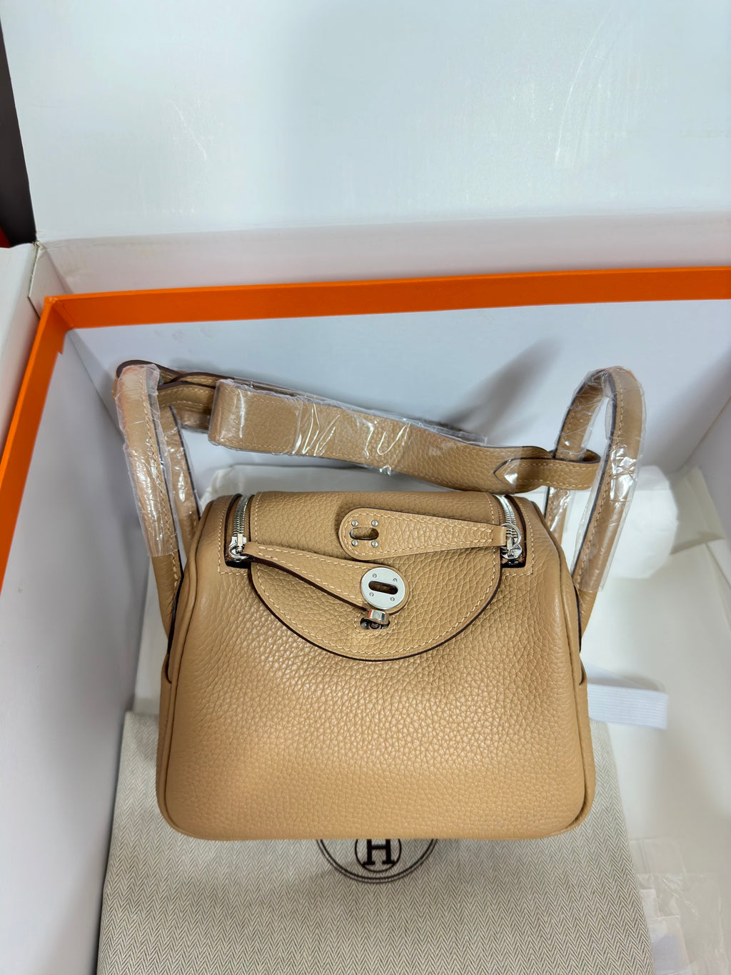 Hermes beige leather mini bag with flap, silver hardware, top handle and shoulder strap