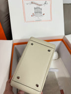 Hermes small leather pouch in light beige with two snap buttons and stitched corners