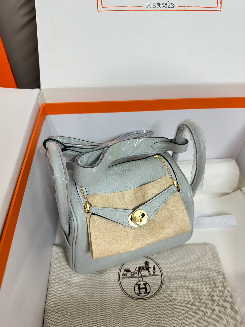 Hermes light blue leather mini bag with small crossbody accessory and gold hardware