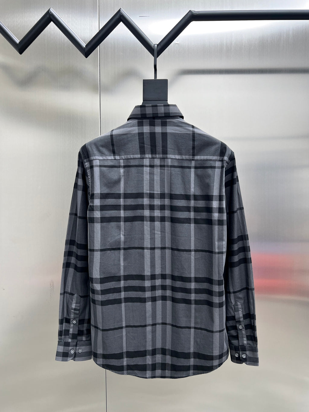 Plaid button-up shirt with dark and light gray check pattern, back view, long sleeves