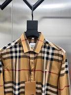 Burberry plaid button-up shirt with spread collar, beige, navy, and red checks
