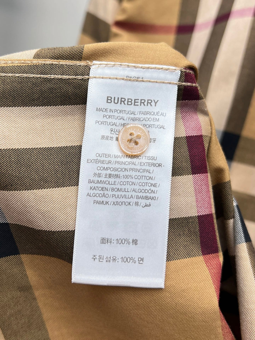 Burberry plaid shirt care label tag on collar seam