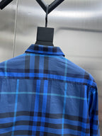 Blue/black plaid long-sleeve shirt back with collar.