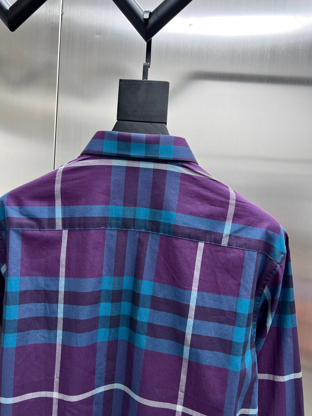 Back of long-sleeve plaid shirt with vertical seams, purple and blue checks