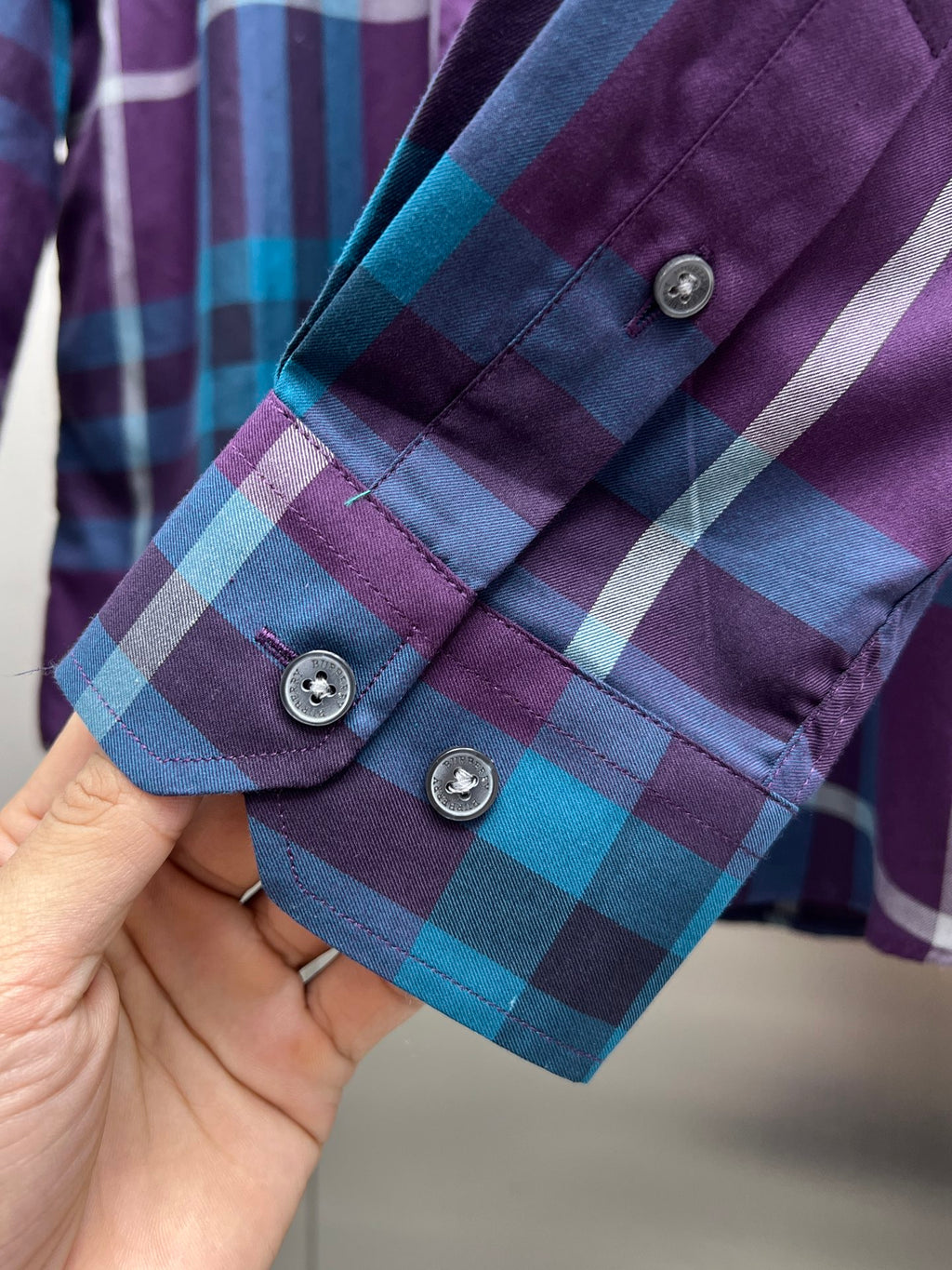 Long-sleeve plaid shirt with button cuffs, purple and blue checks