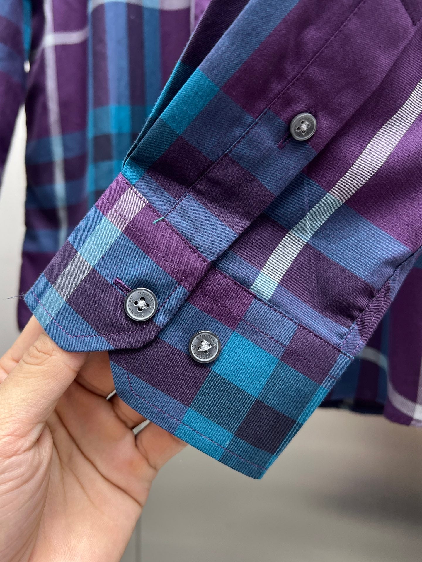 Long-sleeve plaid shirt with button cuffs, purple and blue checks