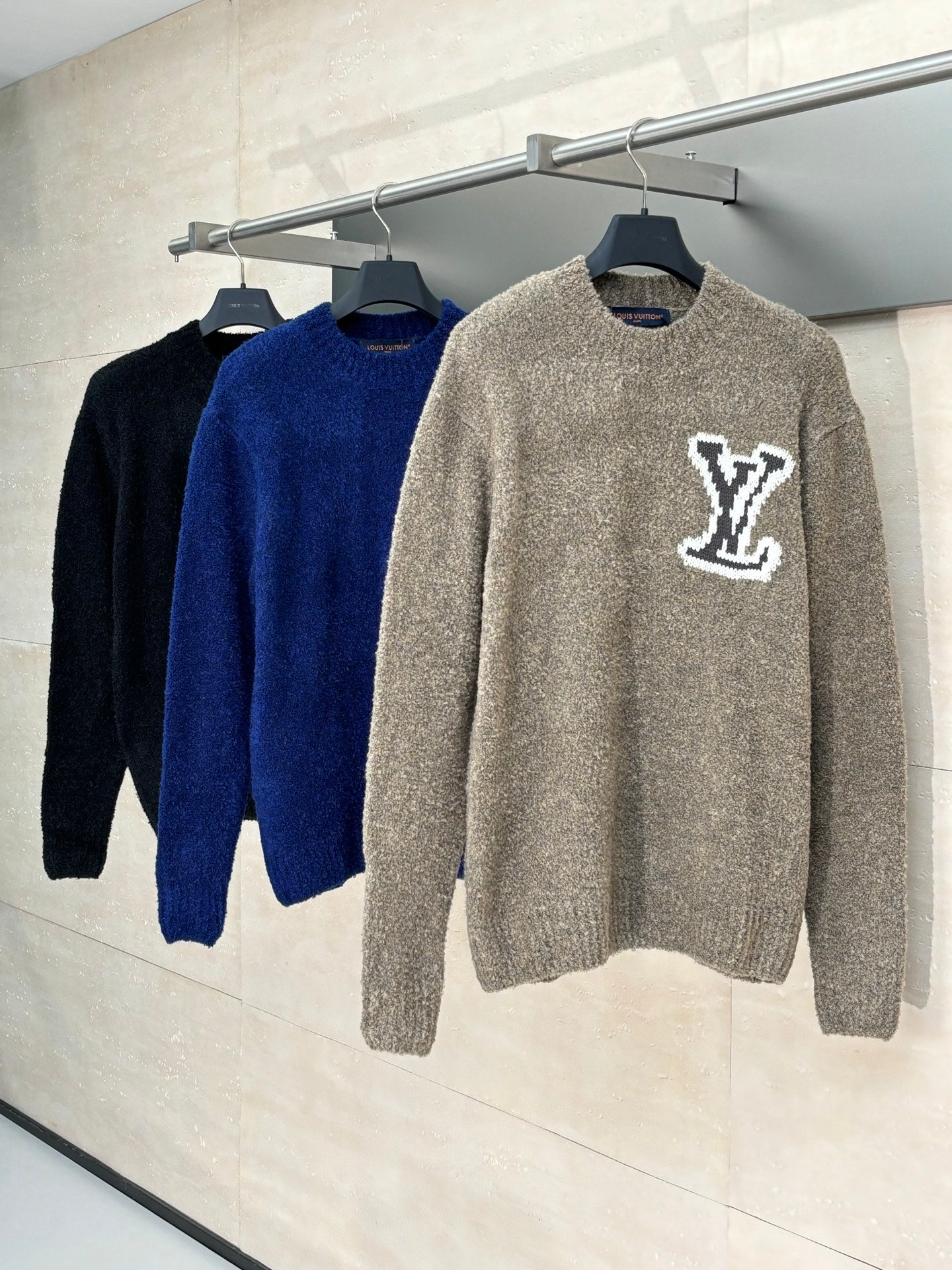 Set of knit sweaters in gray and navy blue with white LV monogram logos