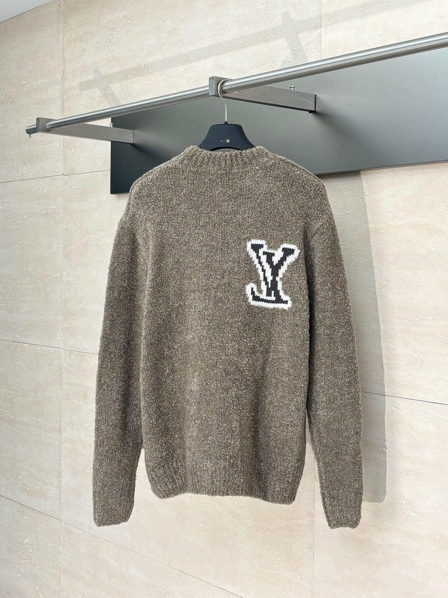 Back view gray knit sweater with white LV monogram logo on shoulders
