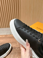 Louis Vuitton lace-up sneaker upper, black with black laces, side close-up