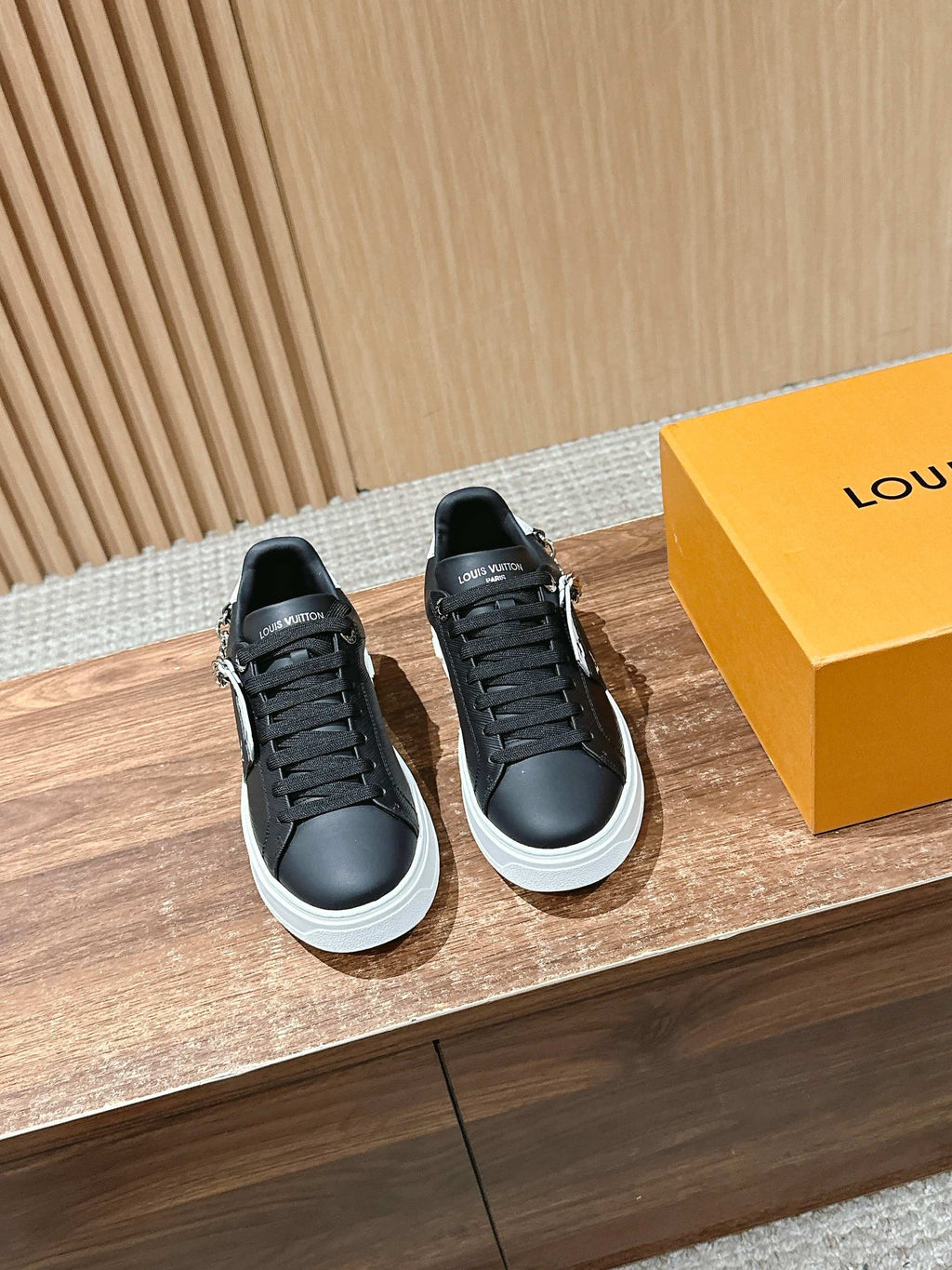 Louis Vuitton lace-up sneakers, black with white sole, side view (pair)